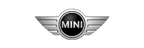 Logo MINI officiel : emblème voiture avec ailes chromées.